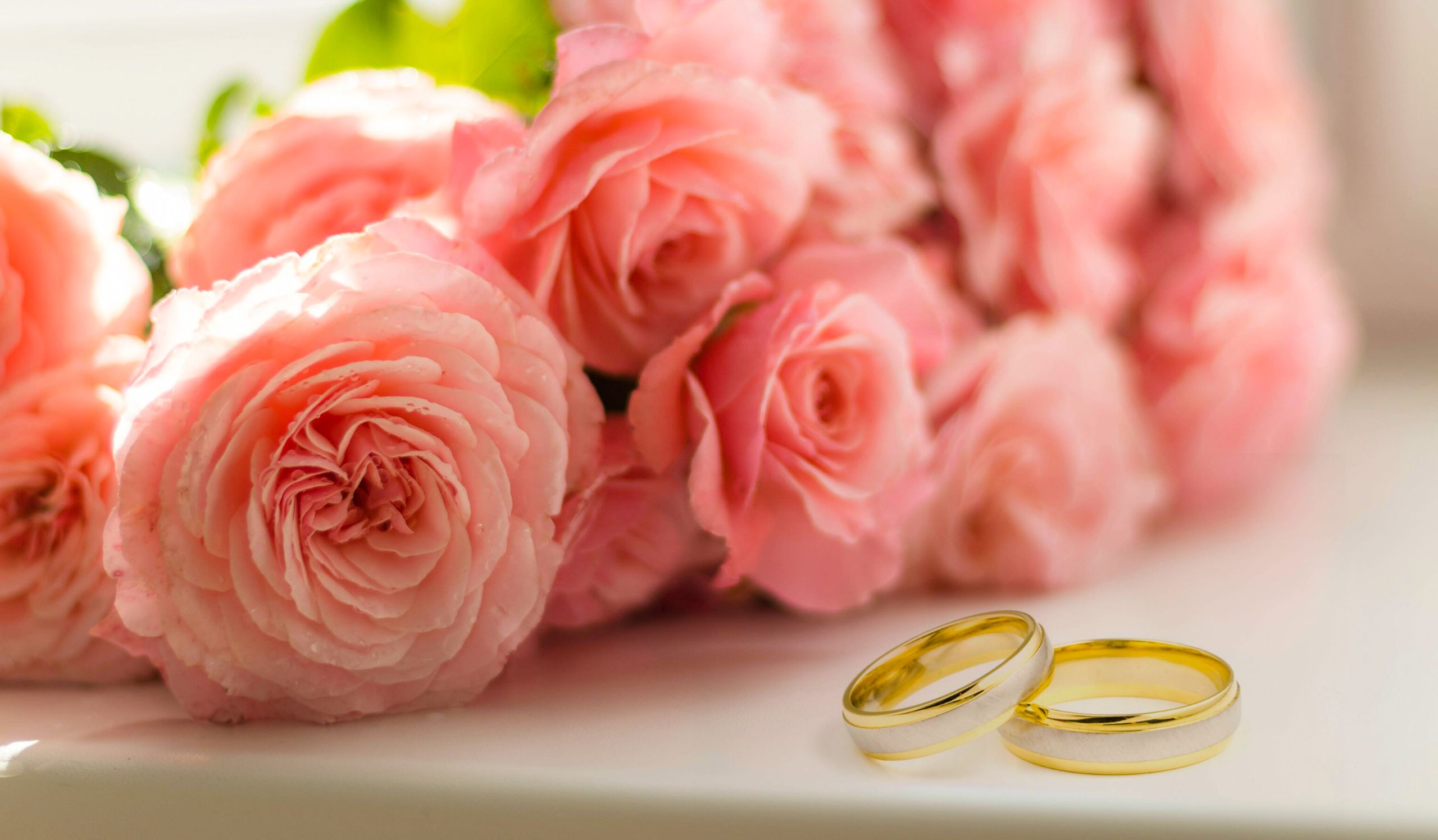 Wedding rings and flowers representing wedding planning templates
